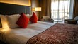 © leymart - Hotel Bed with Red Pillows and Decorative Bedding
