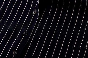 Close up of dark Men's shirt. Soft focus. Copy space.	