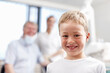 © peopleimages.com - Portrait, boy and checkup with dentist at clinic for appointment, teeth whitening and dental hygiene. Happy, people and patient with mouth cleaning, braces treatment and medical advice for childhood