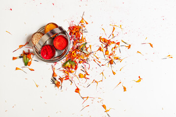 Indian traditional pooja background. Flower petals and rice are spread on the floor after the Hindu pooja ritual. 