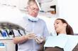 © peopleimages.com - Man, dentist and woman with mould at clinic for cleaning treatment, veneers assessment and teeth whitening. Mature, orthodontics and patient with dental process, root canal and structure inspection