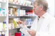 © peopleimages.com - Mature pharmacist, prescription and medication in pharmacy for pills dispensary and healthcare service. Medical professional, employee and man in pharmaceutical store for patient treatment or package