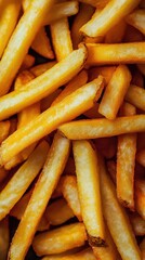 crispy golden french fries piled together in a close-up view, highlighting their texture and color, 