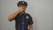 © Krakenimages.com - A surprised african american police officer gesturing with his hand on a white isolated background.