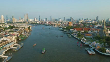 Wall Mural - Aerial view sunset wat arun situated on the west bank of the Chao Phraya River. sightseeing travel Bangkok Thailand