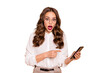 © deagreez - Close-up portrait of her she nice-looking attractive lovely pretty glamorous stunned wavy-haired lady demonstrating reading unexpected news notification isolated over beige pastel background