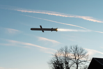 Russian Kalibr missile flies in the sky over private residential sector