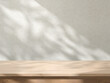 © WB038 - Natural Wood Table with Soft Sunlight Shadows on Rustic Concrete Wall Background, Concept for product presentation display. 3D illustration