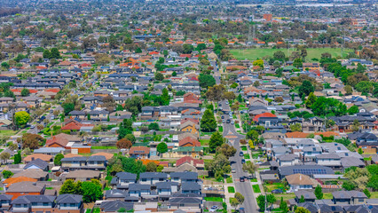 Panoramic aerial drone view of Northern Melbourne Suburbs with Houses roads and parks in Melbourne Victoria Australia