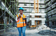 © peopleimages.com - Construction site, architecture and black woman with smartphone, typing and connection. African person, engineering or inspector with cellphone, safety and online reading with digital app or internet