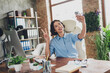 © deagreez - Photo of adorable positive lady broker wear shirt showing v-sign recording video modern gadget indoors workplace workshop