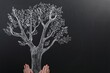 © New Africa - Woman pretending to hold tree drawn on chalkboard, closeup. Space for text