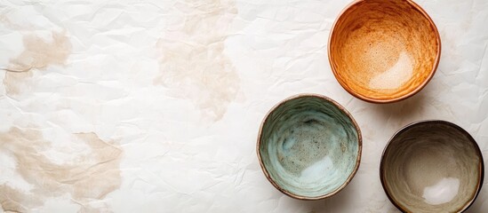 Leinwandbilder - Traditional ceramic bowls set on a paper background Copyspace