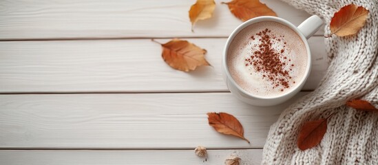 Aufkleber - Autumn arrangement Hot chocolate autumn leaves and a scarf on a light wooden background Flat lay top view copyspace