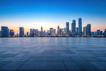 Empty square floor and modern city skyline at dusk with blue sky background