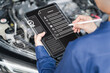 © NongAsimo - Car service checklist online, Quality Conditions concept, Women's Service Center Officer use tablets document check best quality and service, Modern technology Customer Satisfaction, product warranty