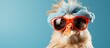 © MUMTAZ - Chicken wearing sunglasses isolated on solid color background, copy space for text.