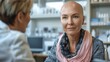 © 怡如 柯 - Bald woman in consultation with doctor discussing cancer recovery and alopecia