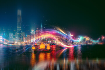 A vibrant cityscape is illuminated with streaks of colorful light, reflecting off the water's surface.