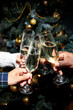 © Seventyfour - Hands of people raising toast clinking glasses with champagne celebrating Christmas together at home party, copy space