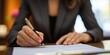 © atipong - A business professional signing a contract in a lawyers office highlighting thorough and legally sound contract drafting