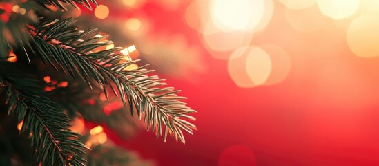 Poster - Christmas decoration featuring fir branches partially blurred against a red background. with copy space image. Place for adding text or design