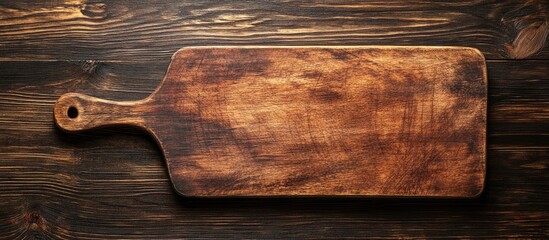 Poster - Wooden cutting board or serving board viewed from above with copyspace for design elements or text