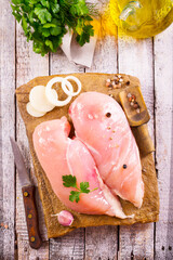 Wall Mural - Raw chicken breast or fillet with salt, pepper and fresh herbs