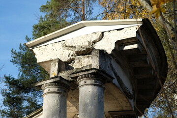 Wall Mural - columns against the background of autumn trees and blue sky