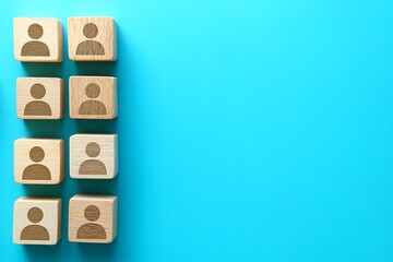 Wooden Blocks with People Symbols A Row Representing Team Connection on Blue Background