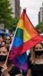© Pixel Matrix - A vibrant rainbow flag with gradient colors symbolizes LGBTQ pride and unity at a diverse festive parade celebrating the LGBT communitys equality and acceptance
