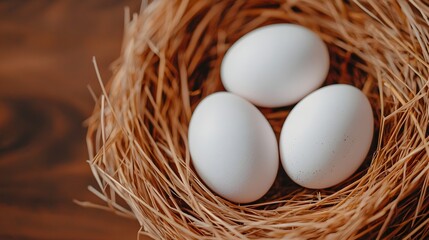 Aufkleber - Closeup of fresh white eggs nestled in a straw nest with natural textures and soft lighting that evokes the simplicity and freshness of farm life