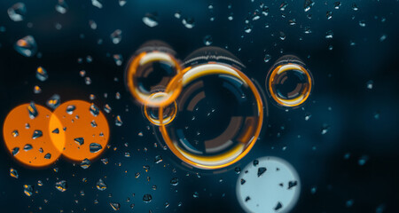 Wall Mural - black background with vibrant orange and yellow circles and water droplets, creating an animated and