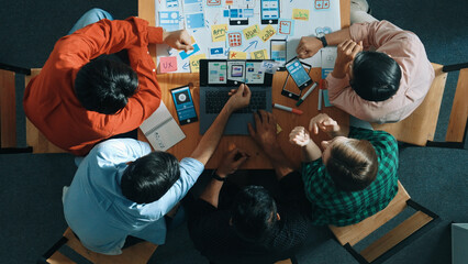 Wall Mural - top view of project manager using laptop working on ux ui design for mobile phone interface while ma