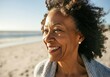 © Running opossum - Close-up of a cheerful senior black woman smiling at the beach, enjoying a sunny day