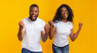 © Prostock-studio - Happy Black Couple Rejoice Success, clench fists and exclaim, panorama