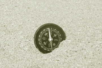Wall Mural - classic navigation compass on natural background
