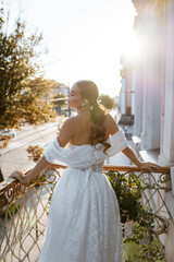 Portrait of a cute adult girl in a modern stylish wedding dress. Wedding trends 2024 2025.