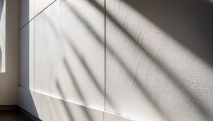 Poster - Minimalist Textured White Wall with Diagonal Sunlight and Shadows. Perfect for Backgrounds, Web Banners, or Modern Design Concepts