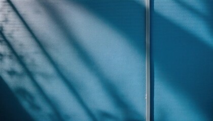 Poster - Abstract Textured Blue Wall with Diagonal Shadows from Sunlight through Window, Minimalist Background for Creative Design, Modern Art Concepts, or Architectural Visualization Projects