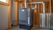 © INT888 - gas furnace is installed in residential setting, showcasing its sleek design and ductwork. image highlights importance of proper installation for safety and efficiency