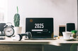 © Gatot - Office desk with 2025 loading bar on laptop screen for happy new year concept