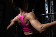© kamonrat - Fit Woman Performing Lat Pulldown Exercise in the Gym, Showing Muscular Back Definition and Dedication to Fitness Training