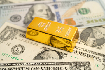 Gold bars with US dollar and Euro banknote money, finance trading investment business currency concept.