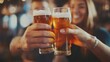 © alan - Cheers and laughter as friends celebrate with beer.