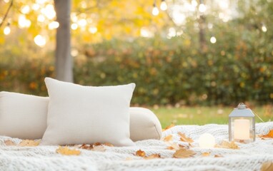 Wall Mural - Cozy Autumn Outdoor Seating with Blankets, Pillows, and Lanterns Amidst Fallen Leaves