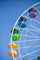 Wall Mural - A colorful carousel with many different colored seats