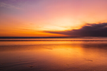 scenery of sunset beach at kuta beach, bali, indonesia.