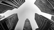 © Thamonchanok - Abstract view of towering skyscrapers in black and white against a cloudy sky.