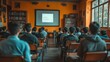 © Muamanah - Students Sitting in a Classroom Facing a Projector Screen